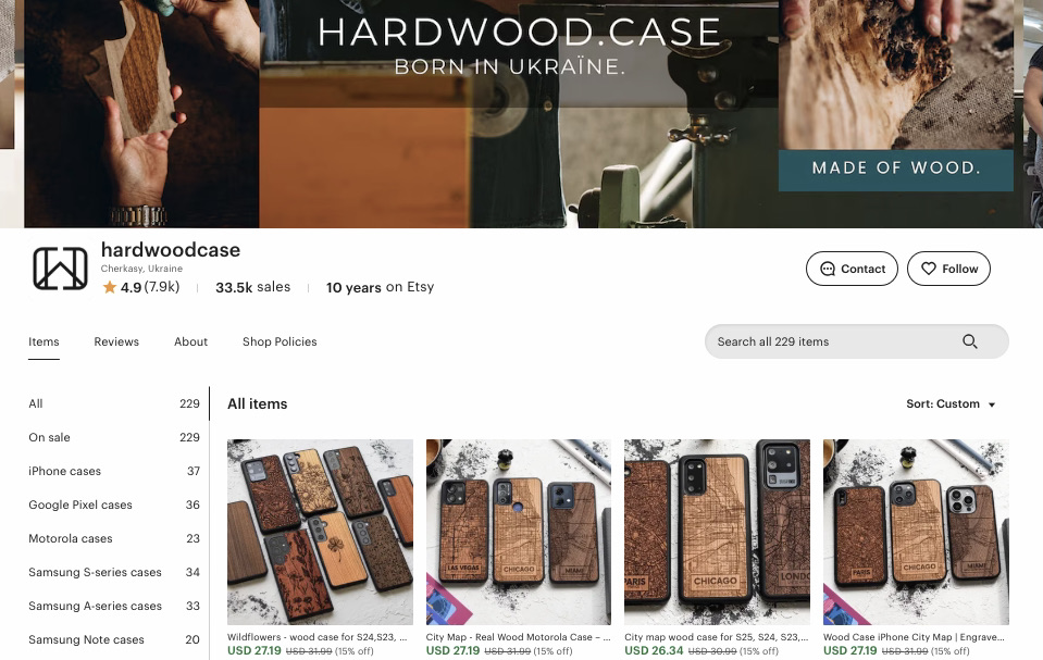 Online business ideas: Screenshot of the hardwoodcase Etsy shop page, showing wooden phone cases with engraved designs displayed in a grid. The shop is based in Ukraine with 33.5k sales and a 4.9-star rating.
