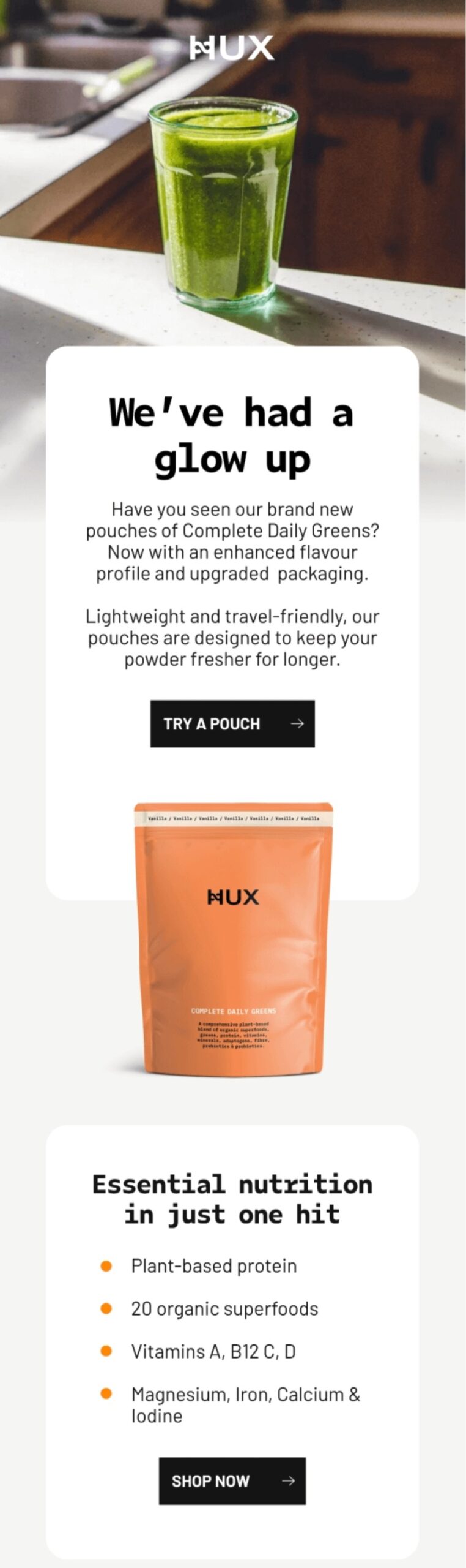 Email marketing examples: A green smoothie in a glass sits on a table above a product ad for HUX Complete Daily Greens, showing an orange pouch and listing benefits like plant-based protein and 20 superfoods.
