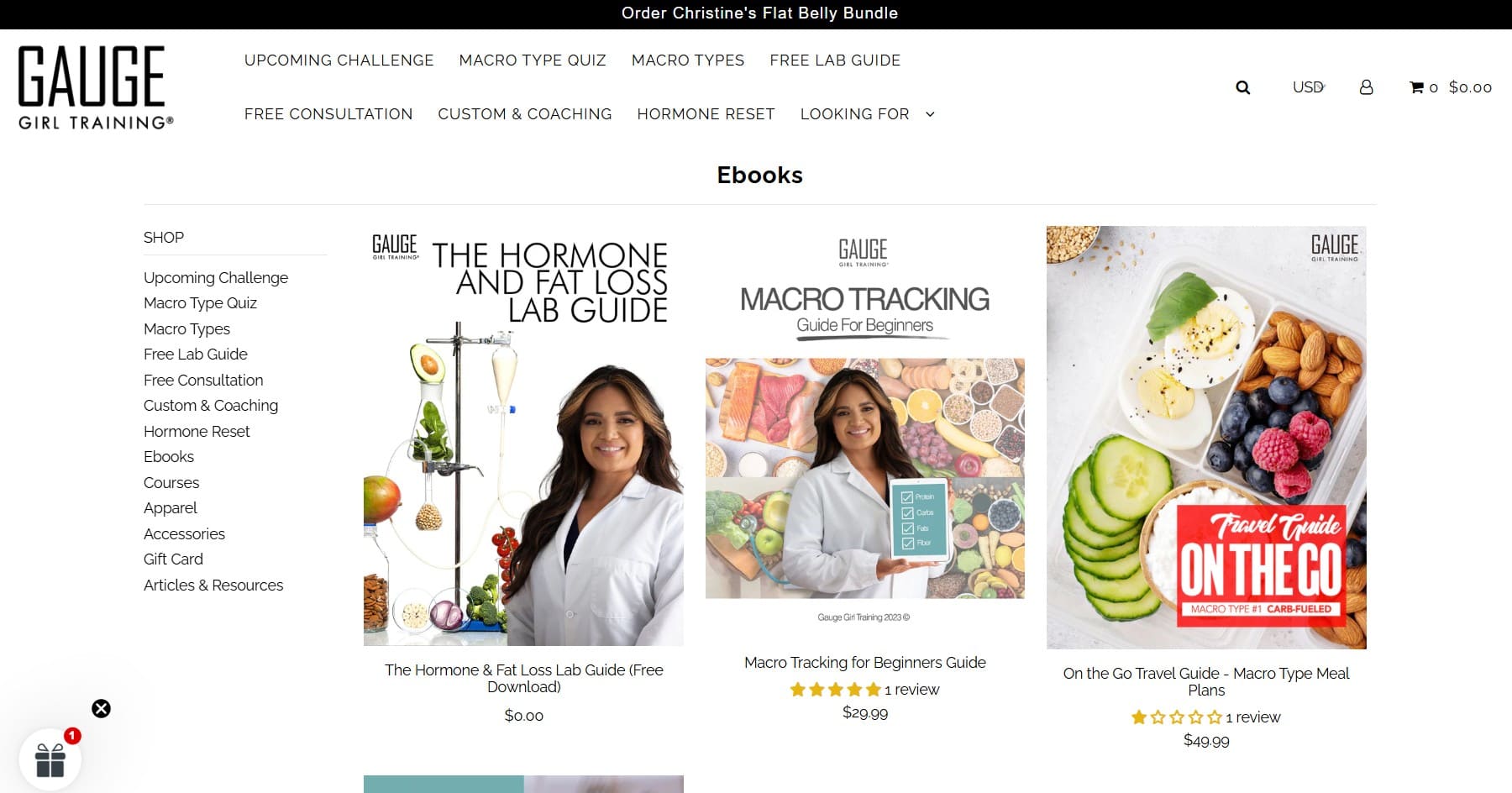 Shopify ebook store: Screenshot of the Gauge Girl Training website’s ebooks section, showing three covers: a woman in a lab coat, a woman with a food scale, and a tray of macro-friendly meals. The sidebar lists links for ebooks and other resources.