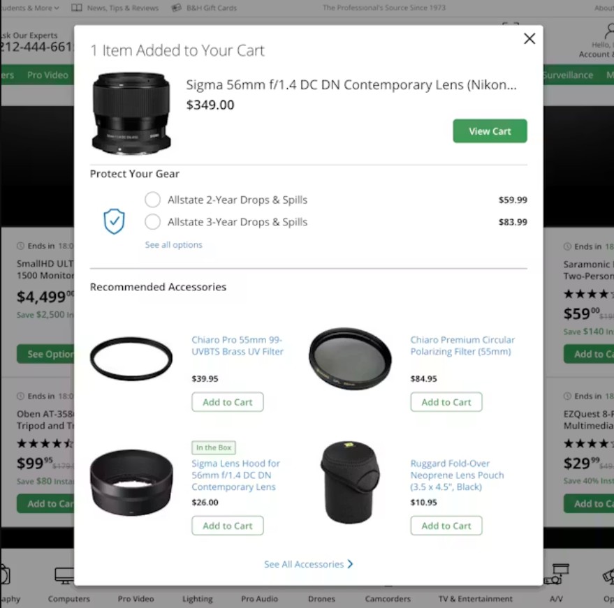 Shopify cross sell: A pop-up shopping cart shows a Sigma 56mm f/1.4 DC DN Contemporary Lens for $349.00, protection plan options, and recommended accessories like filters, hoods, and a lens pouch with prices and add-to-cart buttons.