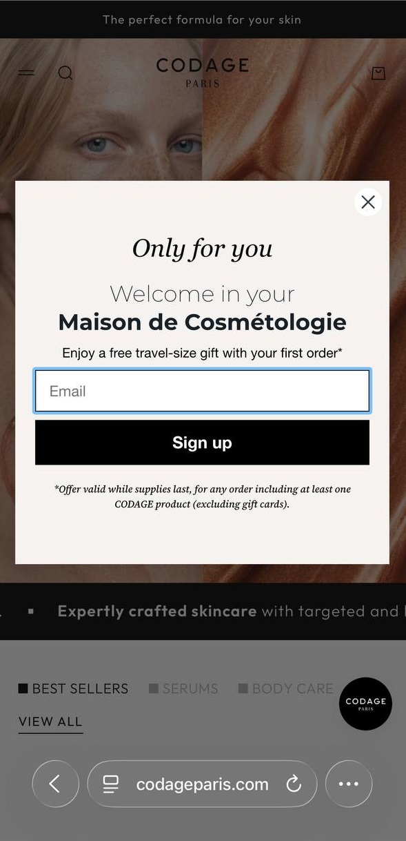 Popup timing: A pop-up window on a skincare website invites users to enter their email for a free travel-size gift with their first order. There is a text field for an email address and a Sign up button.