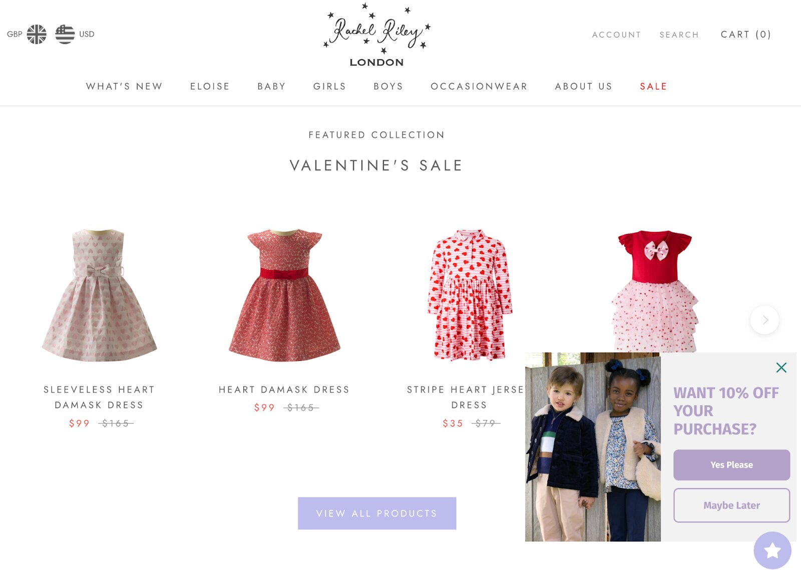 Ecommerce customer acquisition: A webpage for Rachel Riley London shows four red and pink heart-themed girls’ dresses on sale for Valentine’s Day. A pop-up offers 10% off with a photo of two children and buttons to accept or decline.