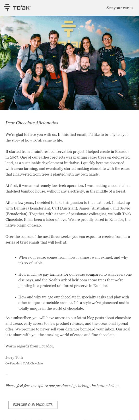 Ecommerce customer acquisition: A group of ten people pose together and smile in front of a backdrop featuring lush green hills and mountains. Above them is the Toak chocolate logo and a yellow sign reading From seed to bar. The image appears in an email newsletter.