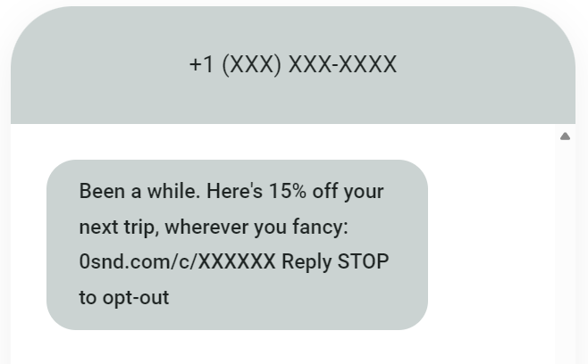 SMS marketing for travel agencies: A text message offers 15% off a trip with a link and opt-out instructions, from a sender with a hidden phone number.