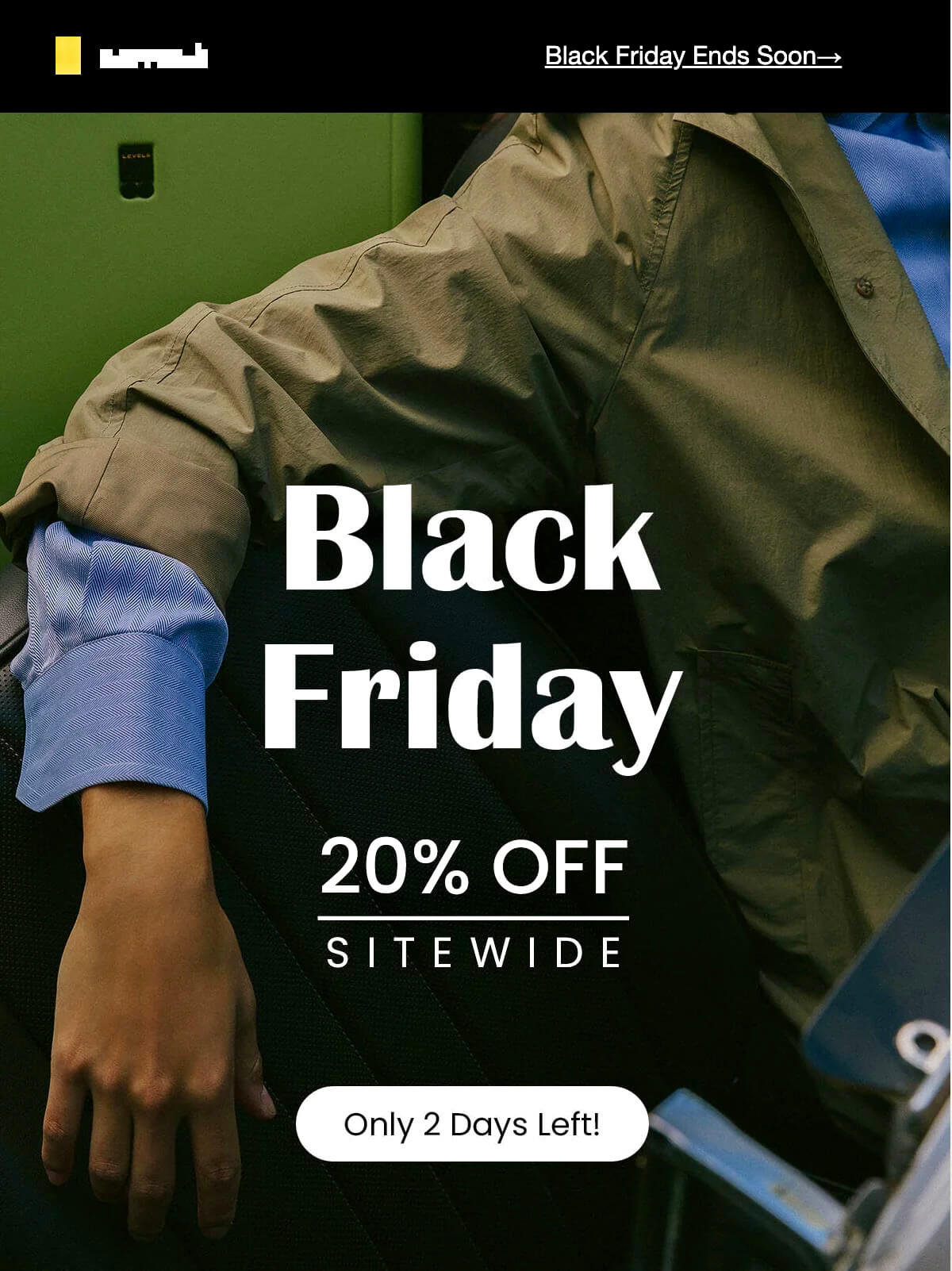 Email automation examples: A person in a green jacket and blue shirt sits with their arm resting on a chair. Text over the image reads: Black Friday. 20% OFF SITEWIDE. Only 2 Days Left! Black Friday Ends Soon.