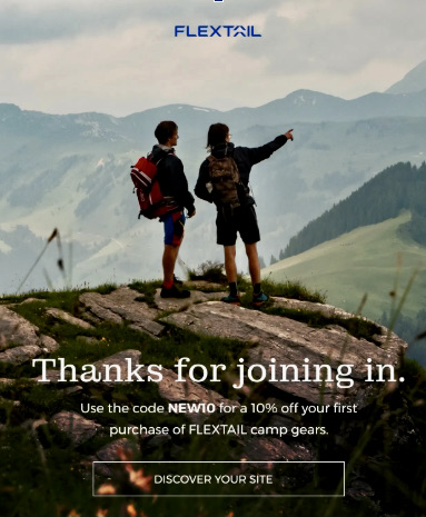 Email automation examples: Two hikers with backpacks stand on a grassy mountain ledge, pointing towards distant peaks. Text offers 10% off first purchase of FLEXTAIL camp gear with code NEW10 and a button says Discover Your Site.