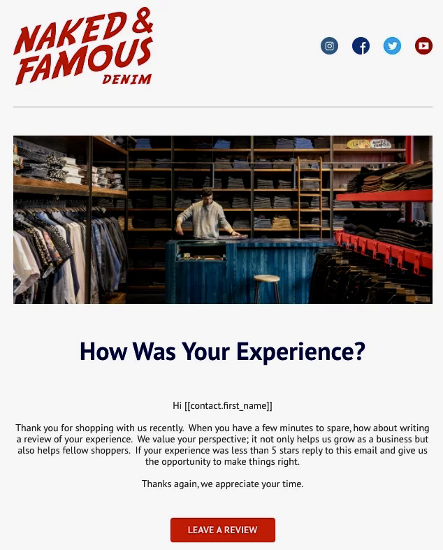 Email automation examples: A man stands behind a blue counter in a denim store with shelves of folded jeans. Text below asks customers to rate their experience shopping at Naked & Famous Denim and includes a Leave a Review button.