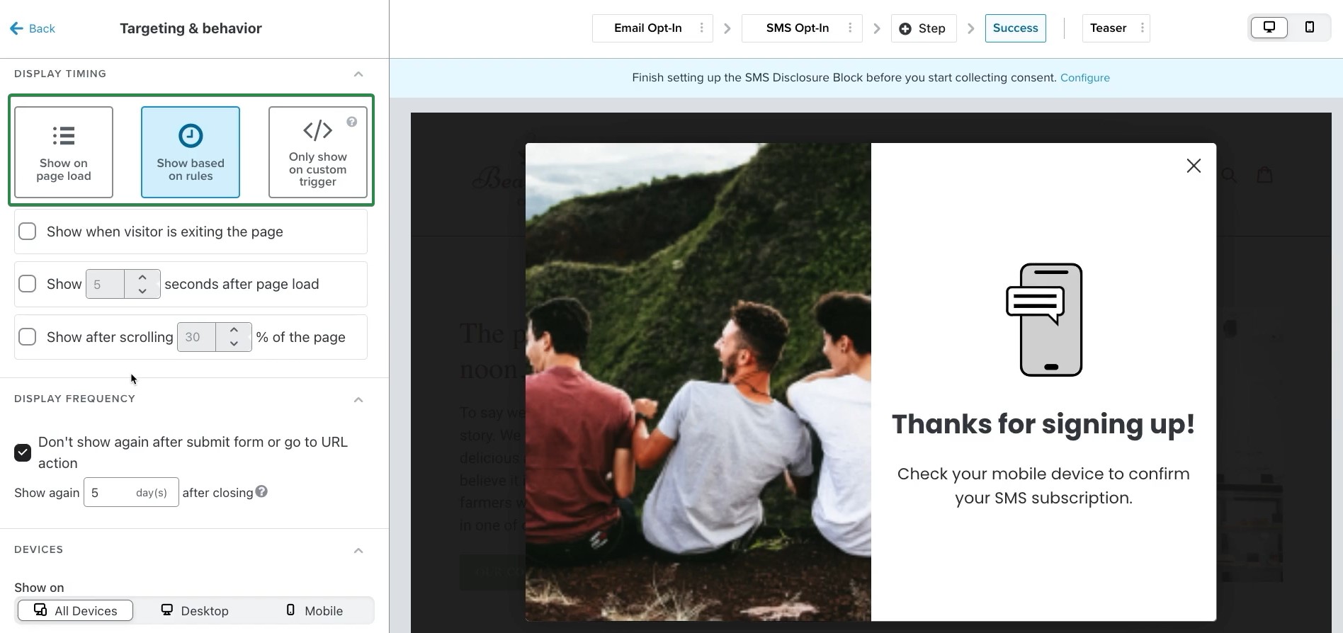 Klaviyo review pricing features: A website interface shows a popup setup screen. The popup preview displays three people sitting on grass facing away, with a message: “Thanks for signing up! Check your mobile device to confirm your SMS subscription.”.