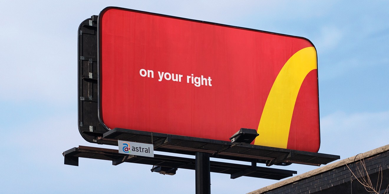 Guerilla marketing: A red billboard with the words on your right in white text and a partial yellow arch resembling the McDonalds logo, indicating the location of a nearby McDonalds restaurant.