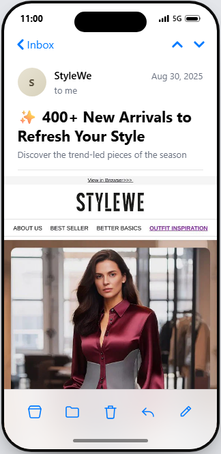 August newsletter ideas: A smartphone screen shows a StyleWe email featuring 400+ New Arrivals to Refresh Your Style with a woman in a maroon satin blouse and grey skirt, plus navigation links at the top.