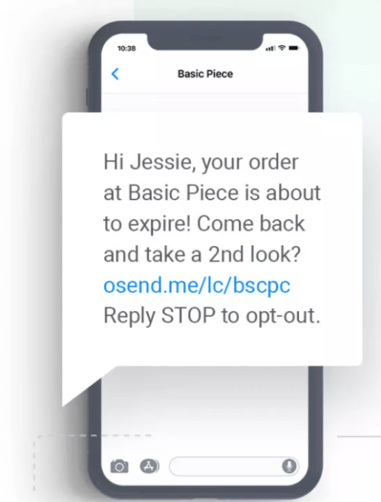 Black friday SMS: A smartphone screen showing a text message: Hi Jessie, your order at Basic Piece is about to expire! Come back and take a 2nd look? osend.me/lc/bscpc Reply STOP to opt-out..