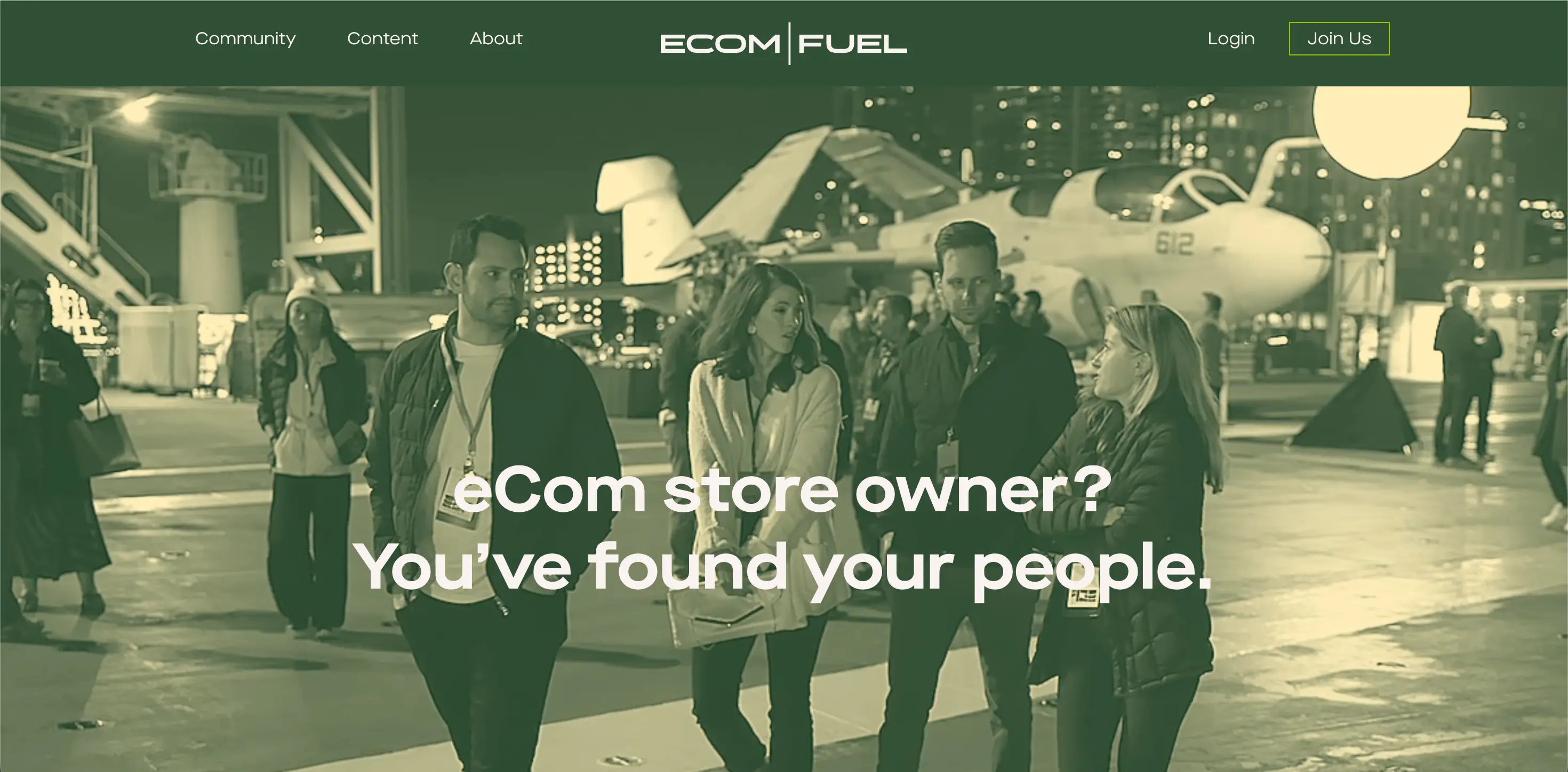 Ecommerce community: Four people talk and walk together on an aircraft carrier at night, with planes in the background. Text on image reads: eCom store owner? Youve found your people. Ecom Fuel logo and menu are at the top.