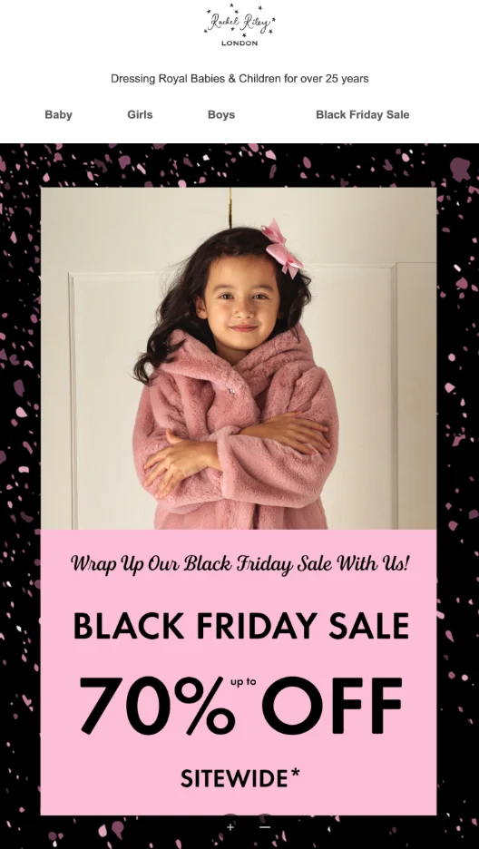 Black Friday marketing: A young girl in a pink fuzzy coat stands smiling with arms folded. The ad promotes a Black Friday sale offering up to 70% off sitewide on childrens clothing. The background is pink with black accents and starry details.