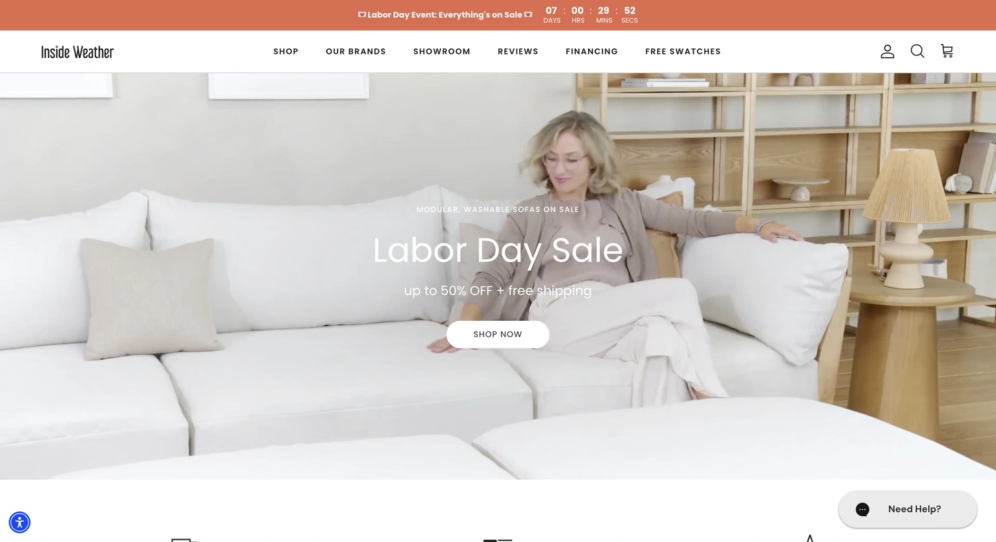 Woman sitting on a white sectional sofa in a living room, with text overlay promoting a Labor Day sale for furniture.