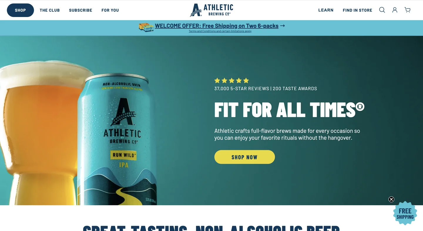 Athletic Brewing’s homepage featuring a can of Run Wild IPA alongside a glass of beer, with the headline “Fit for All Times” promoting its non-alcoholic beer.