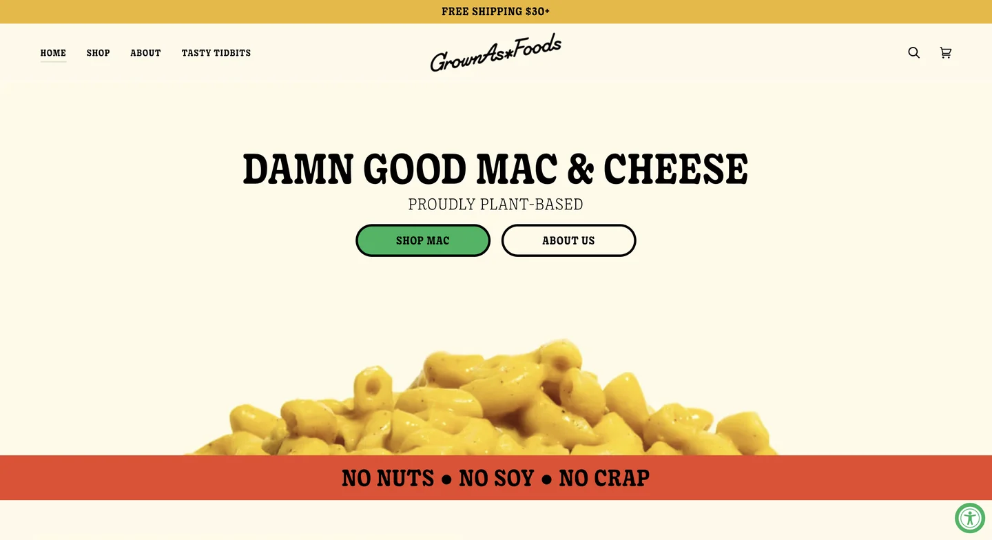GrownAs* Foods’ homepage featuring vegan mac and cheese with the headline “Damn Good Mac & Cheese.”
