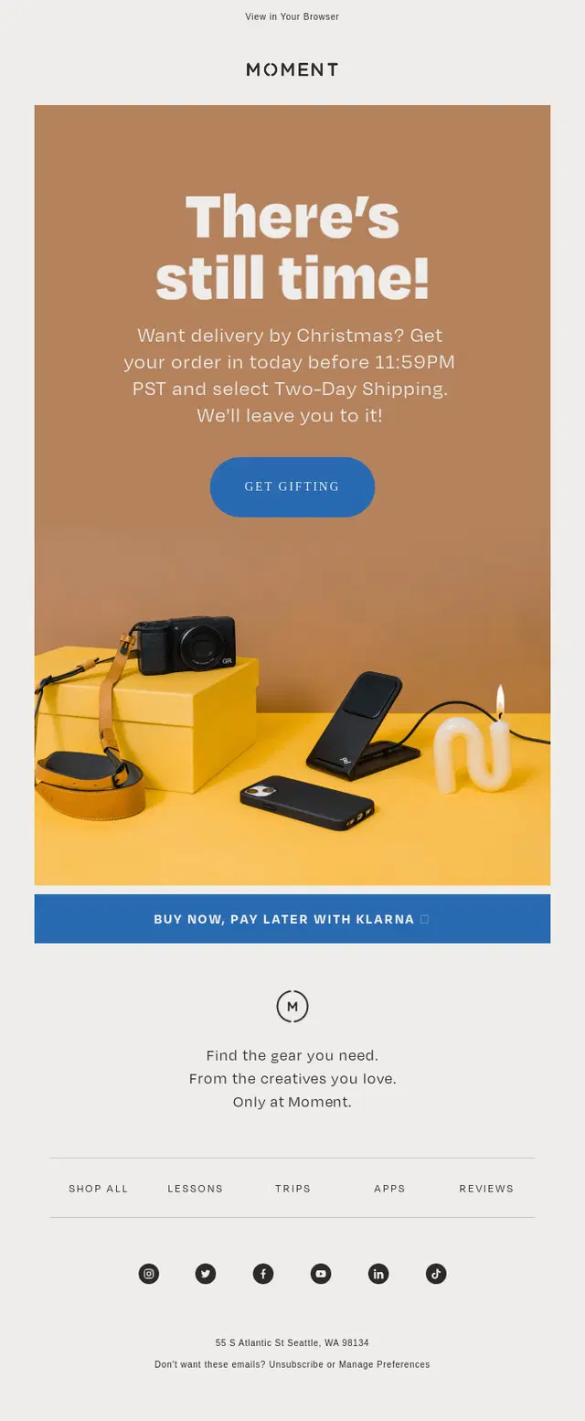 Moment email promoting Christmas delivery deadlines with products including a camera, wireless charger, and candle.