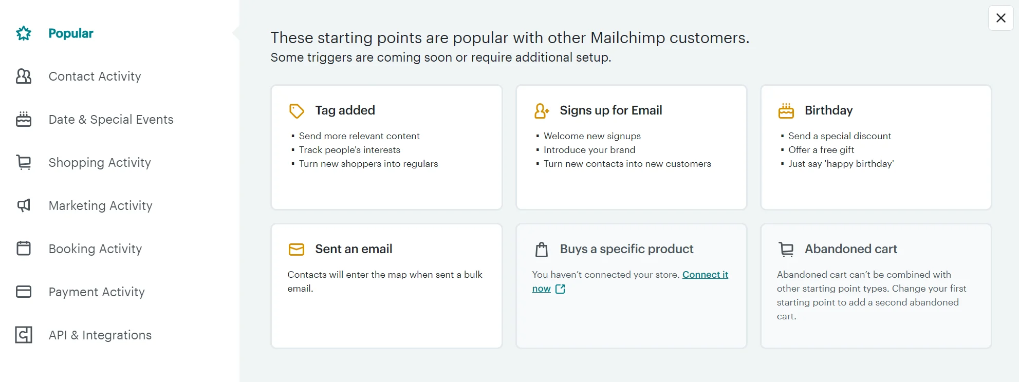 Mailchimp menu showing popular automated workflow triggers like tag added, email signup, and birthday.